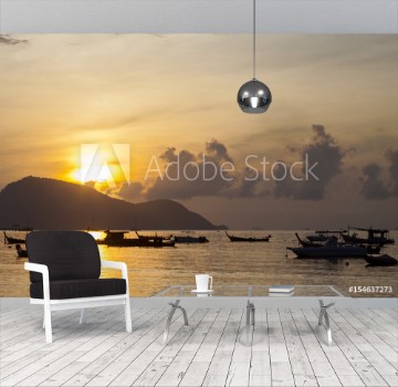 Picture of Beautiful sunrise seascape view with boat in phuket island